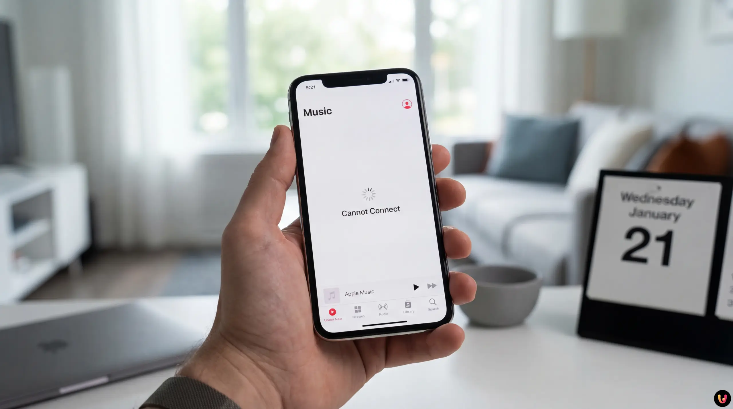 Logo Apple Music sur un &eacute;cran de smartphone avec une ic&ocirc;ne de chargement